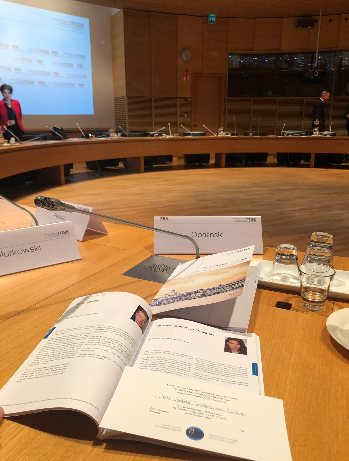 Opalinski nameplate and participant booklet at the conference table